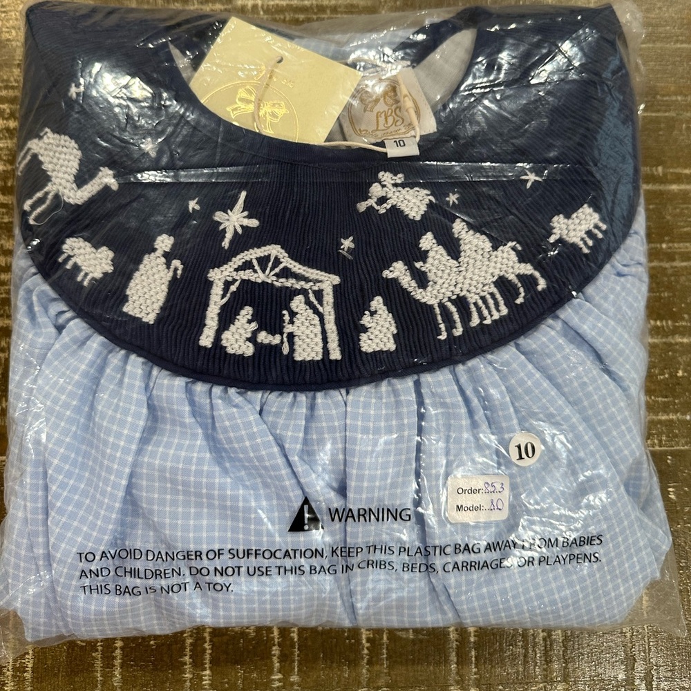 Nativity outfit girls size 10. Smocked top with Navy Blue pants. New with tags.